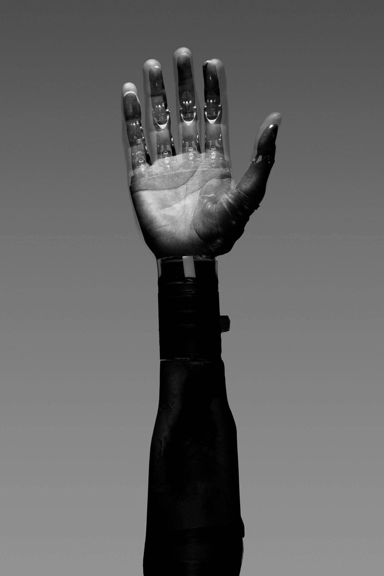 A digitally enhanced hand with a robotic overlay, symbolising the integration of technology and automation in modern marketing.