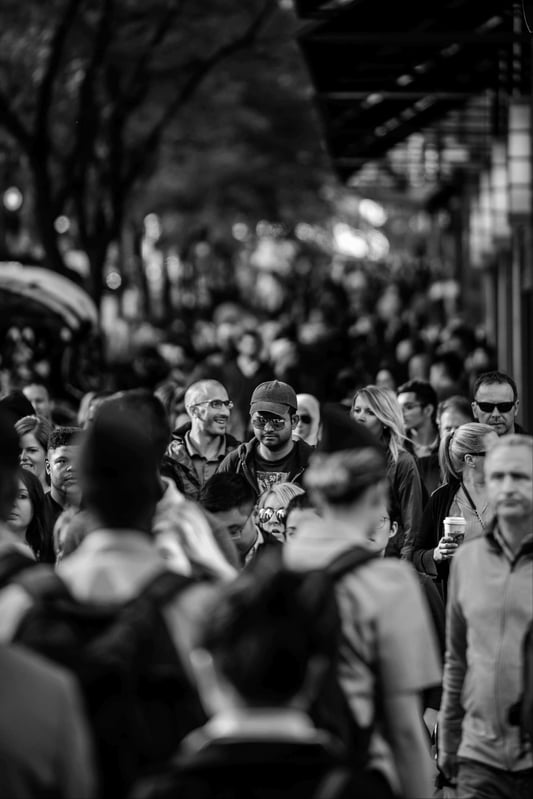 A busy city street filled with people walking in different directions, symbolising diversity and movement.